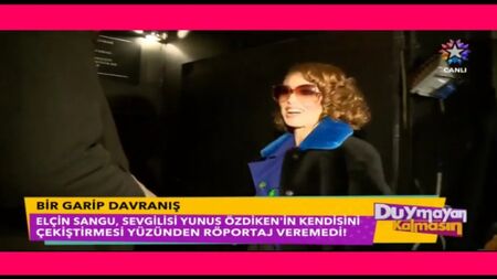 Elçin Sangu não conseguiu dar a entrevista porque o namorado, Yunus Özdiken, a puxou (480 x 854)
